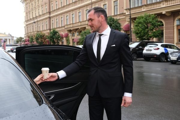 Chauffeur Hire Giving Coffee